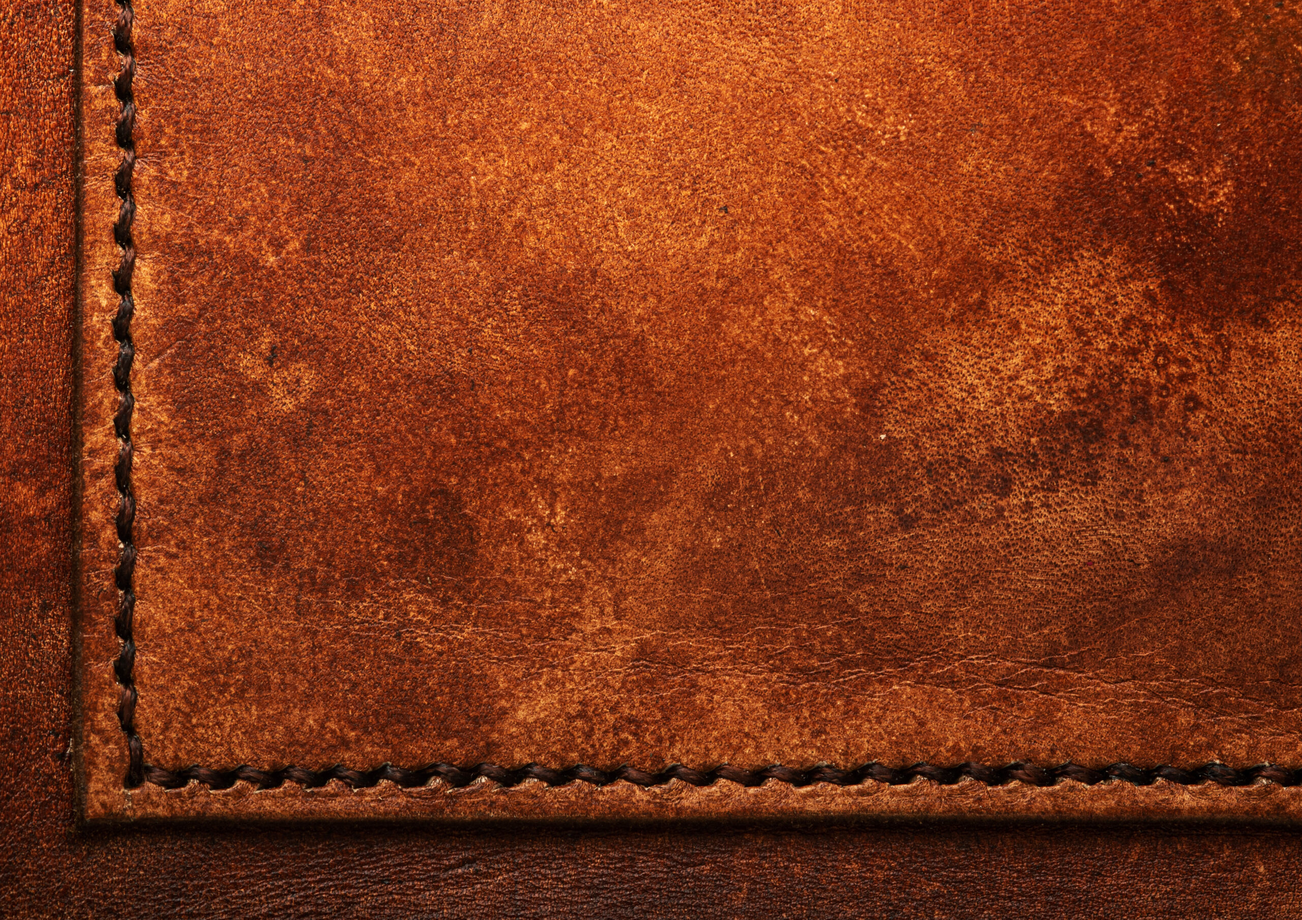 Hand-stitched leather macro detail