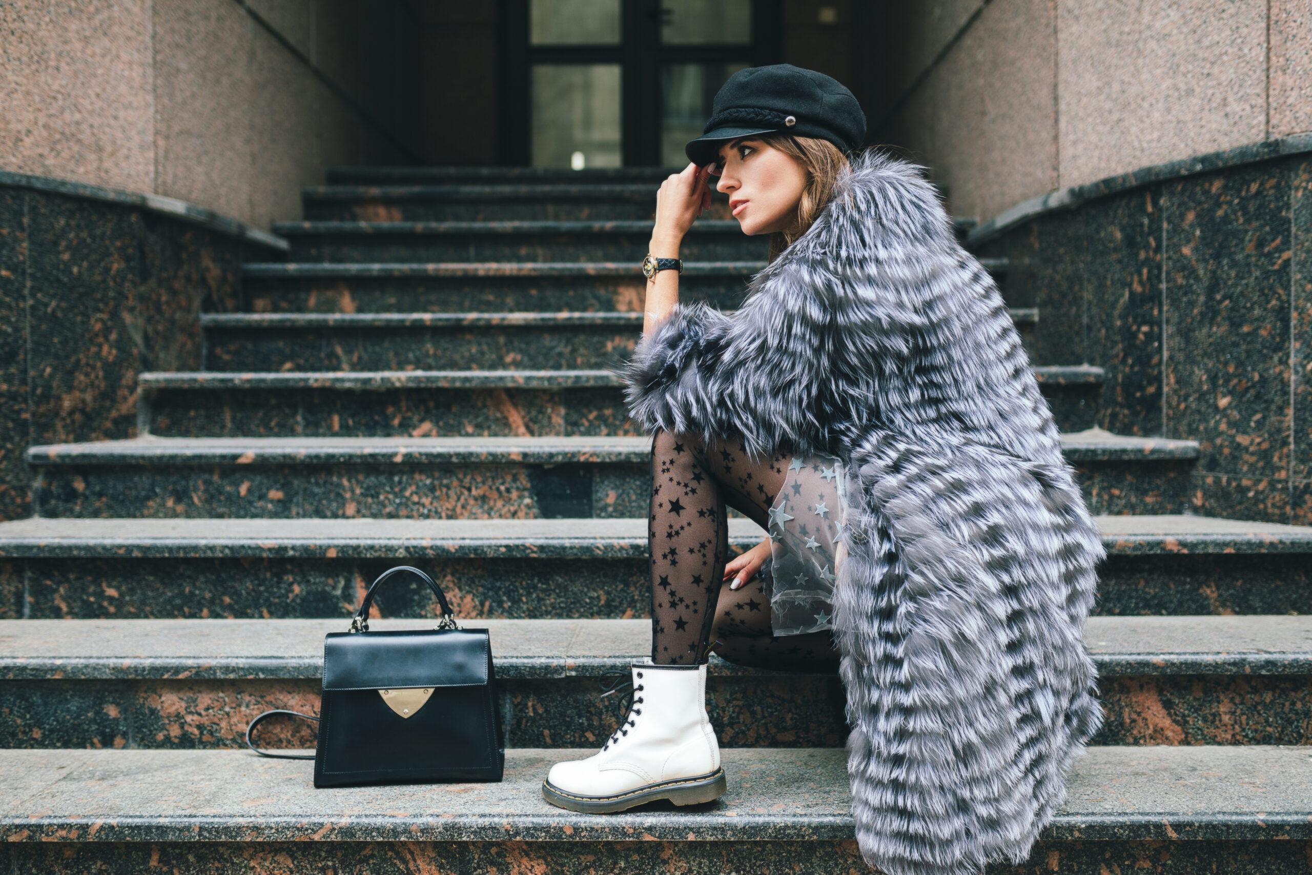 Woman carrying a leather handbag on the street